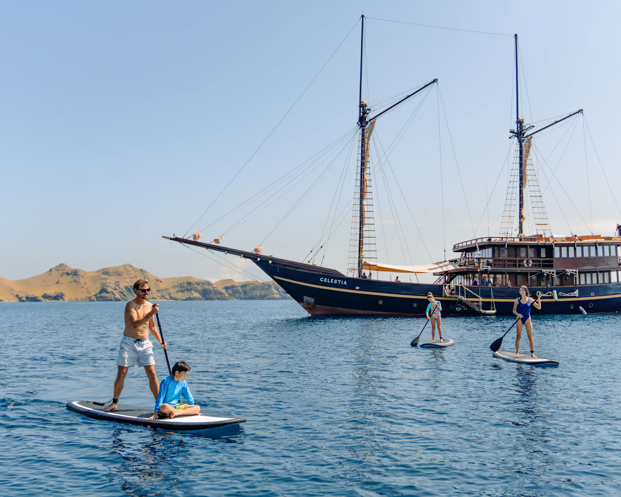 Celestia Luxury Yacht | Paddleboarding beside Celestia in Komodo