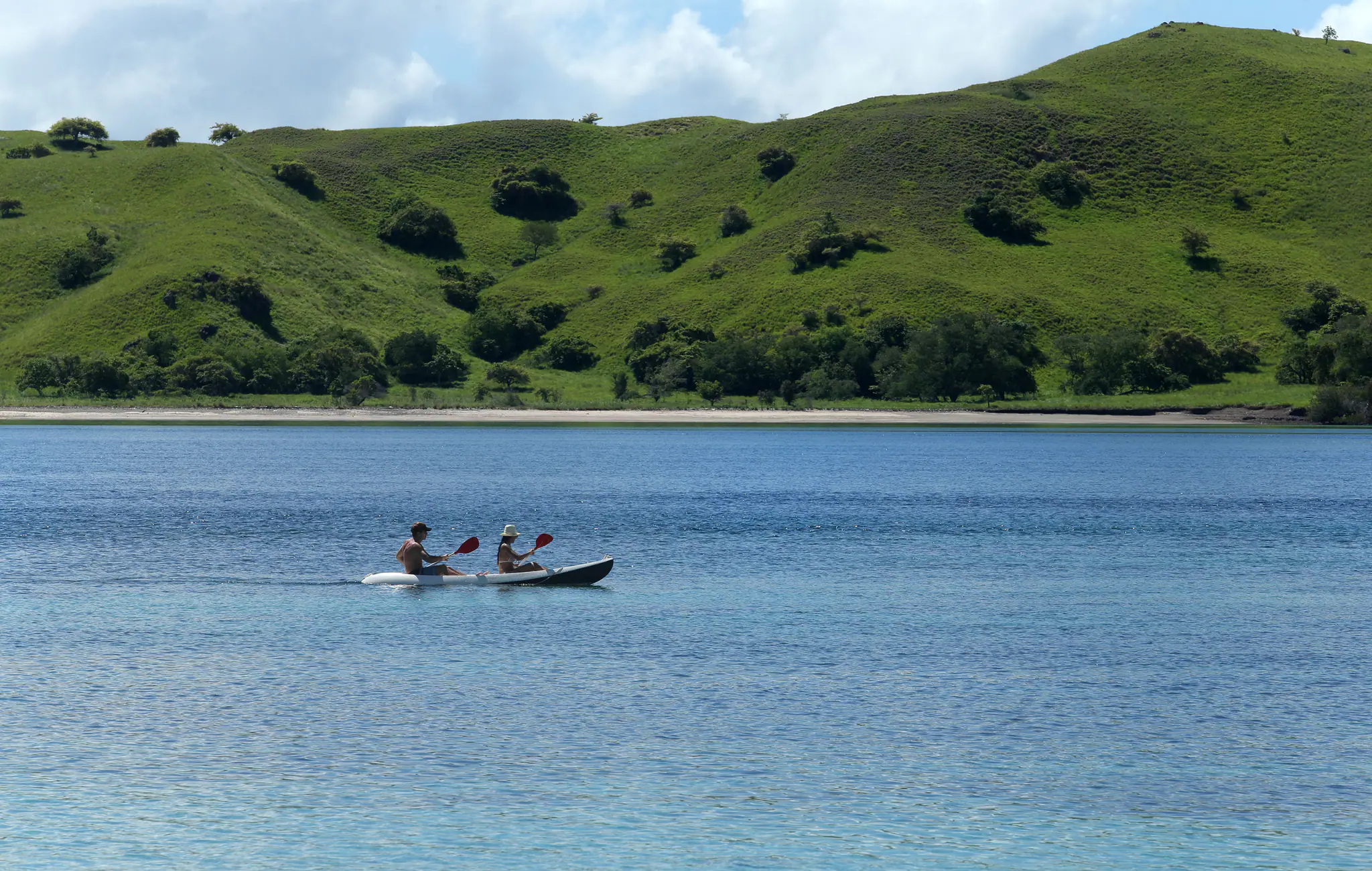 Alila Purnama Boutique Sailing Yacht | Kayaking beside green island landscapes
