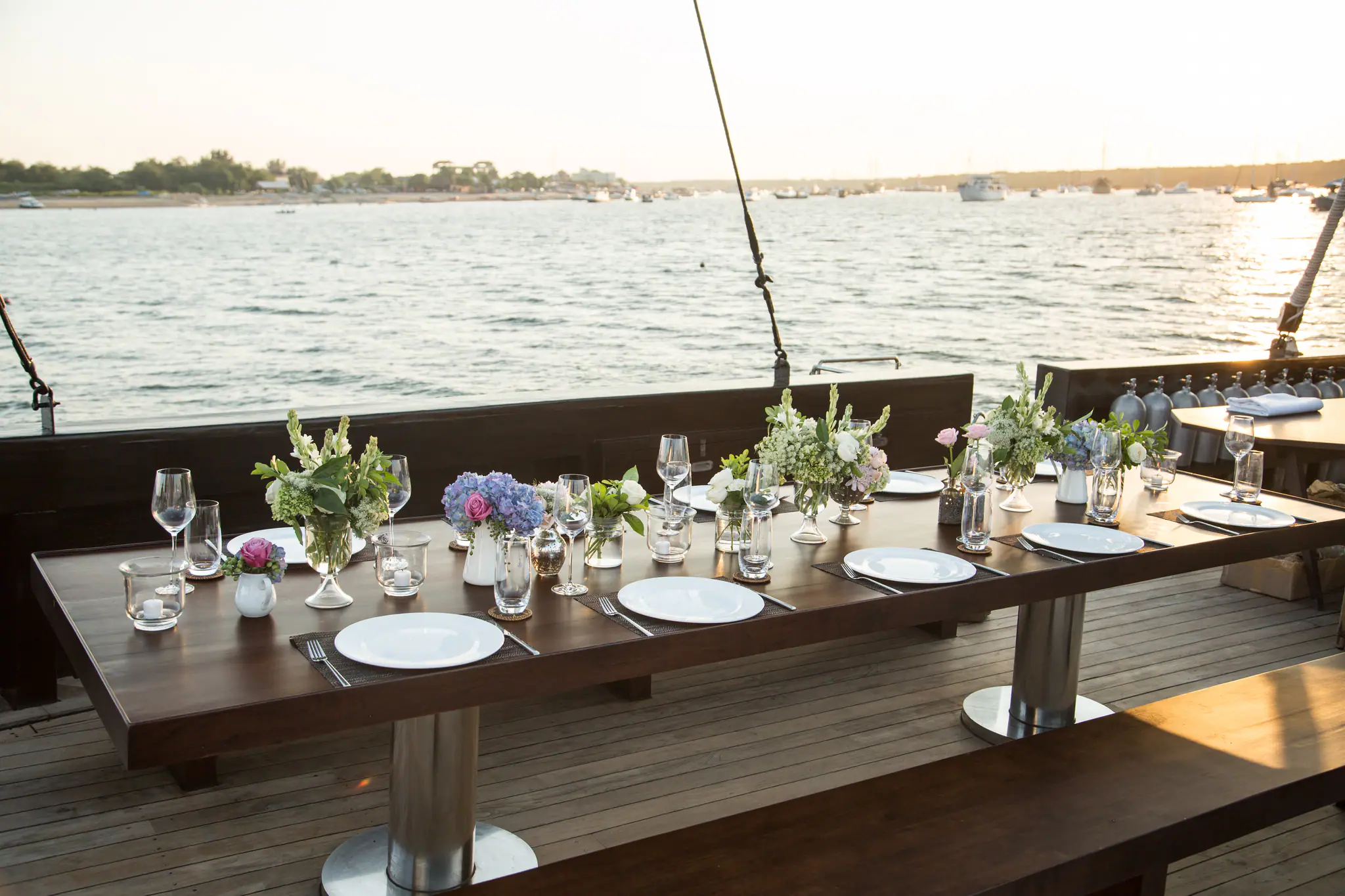 Alila Purnama Boutique Sailing Yacht | Outdoor dining setup at sunset