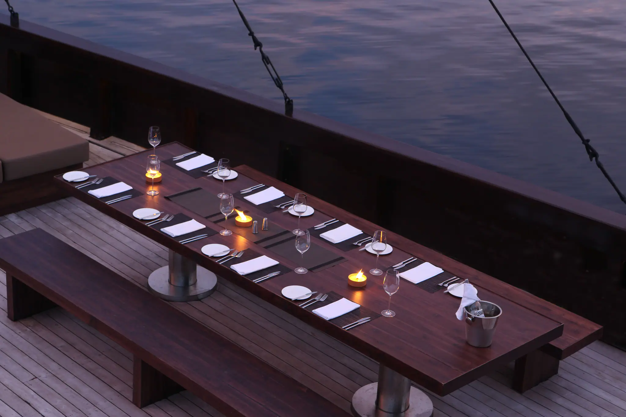 Alila Purnama Boutique Sailing Yacht | Evening dining atmosphere on deck