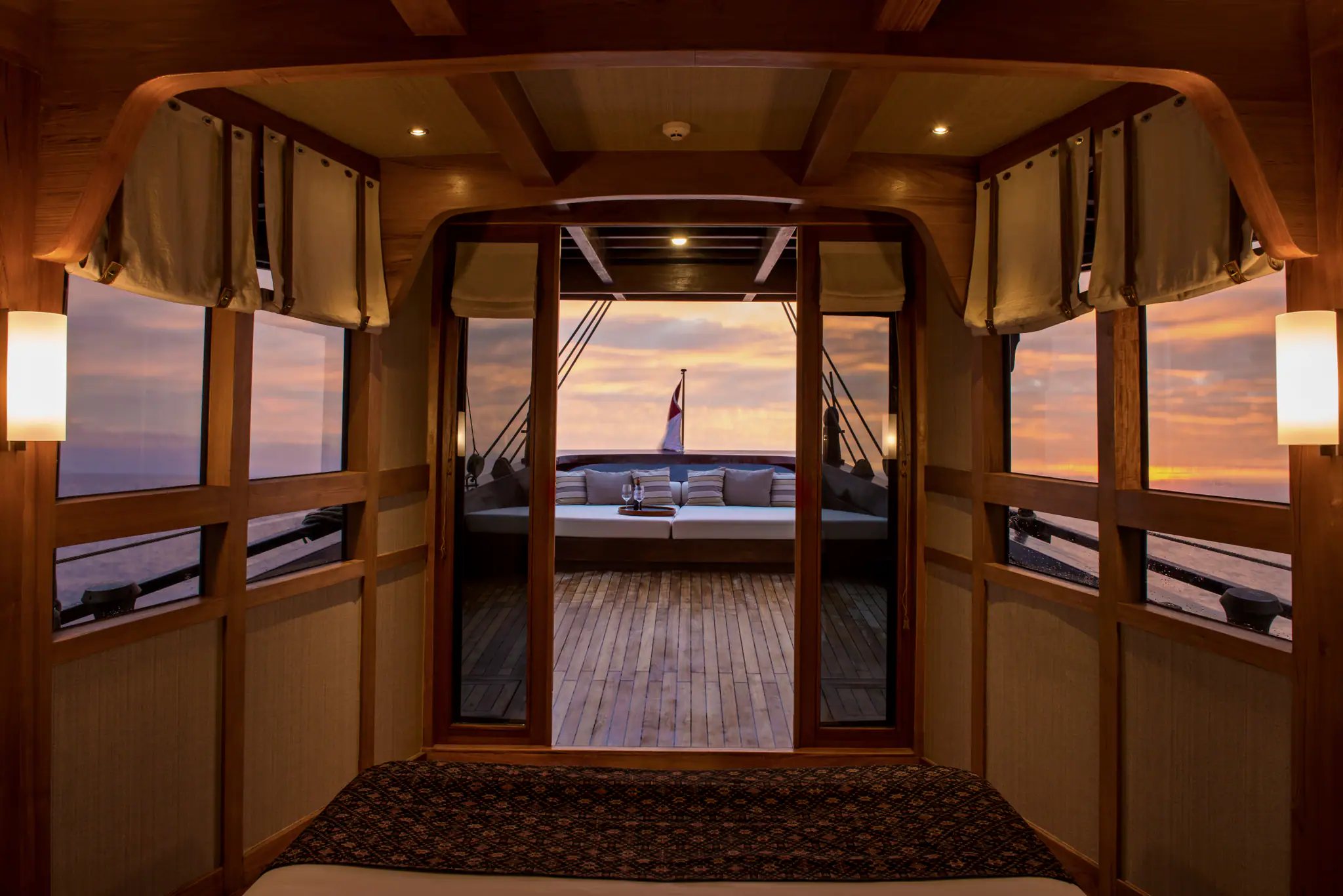 Amandira Luxury Sailing Yacht | Cabin's balcony view at sunset