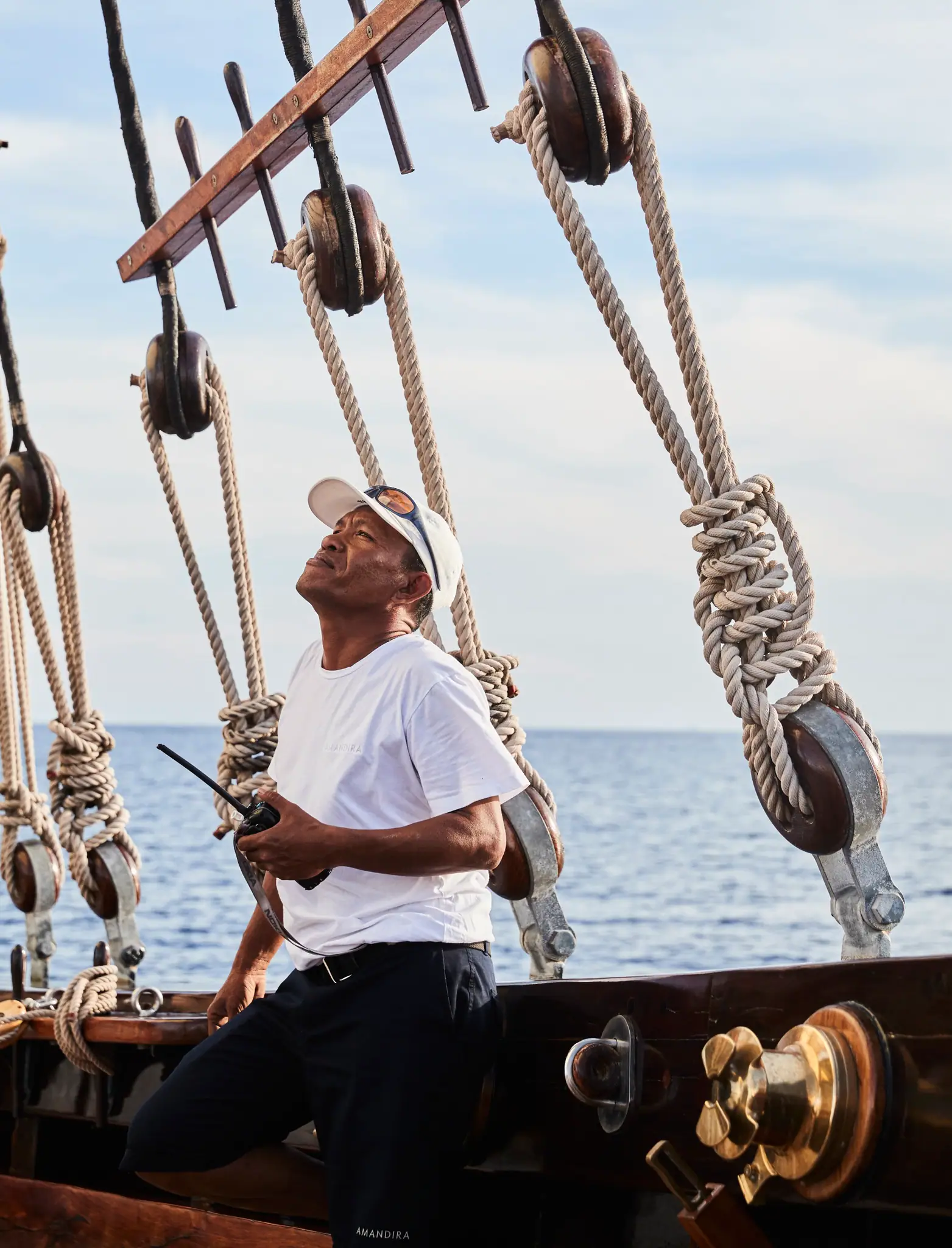 Amandira Luxury Sailing Yacht | Crew member managing rigging