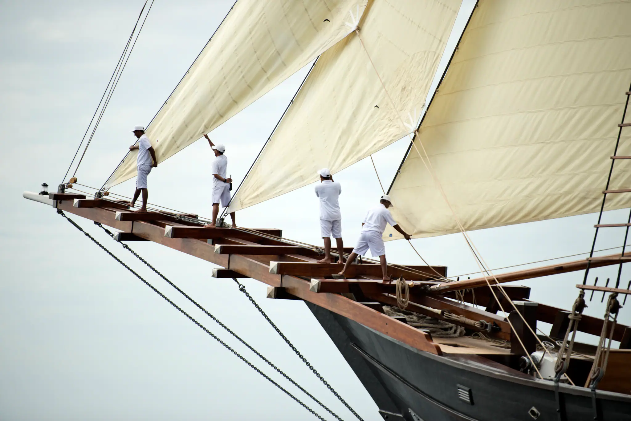 Amandira Luxury Sailing Yacht | Crew raising traditional sails