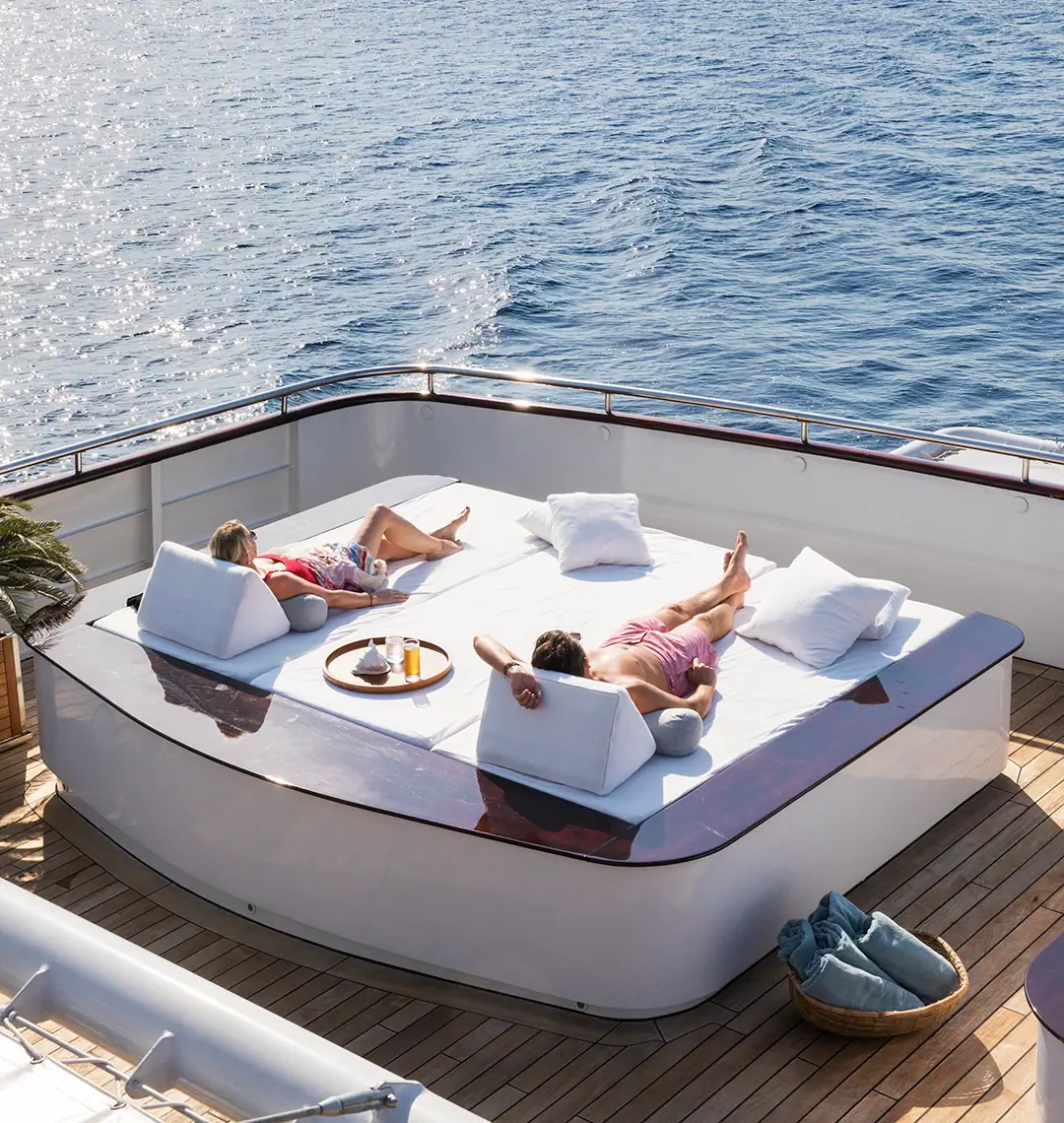Aqua Blu Expedition Yacht | Guests relaxing on sundeck