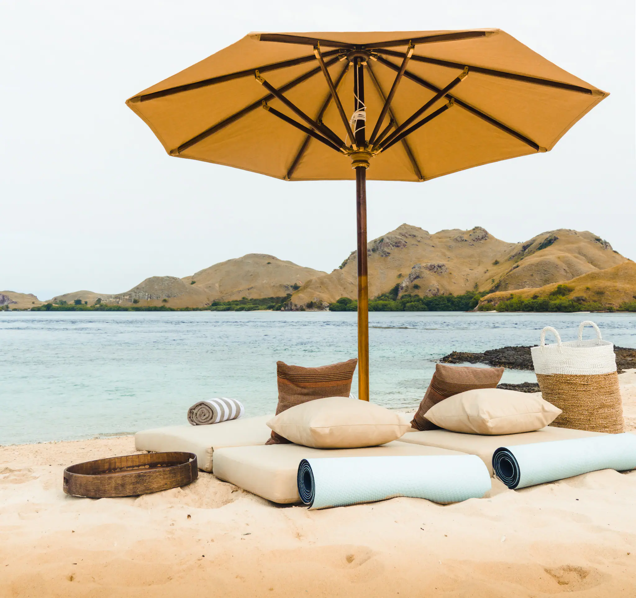 Celestia Luxury Yacht | Beach setup overlooking Komodo islands