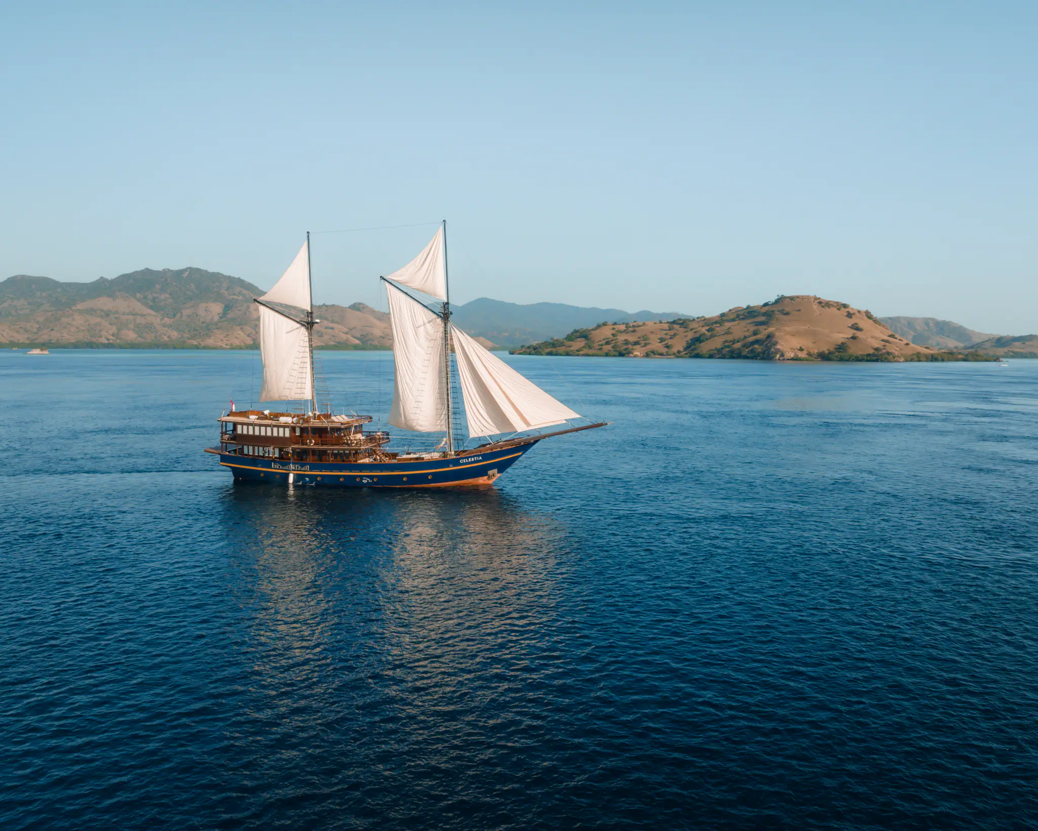 Celestia Luxury Yacht | Celestia sailing at day in Komodo