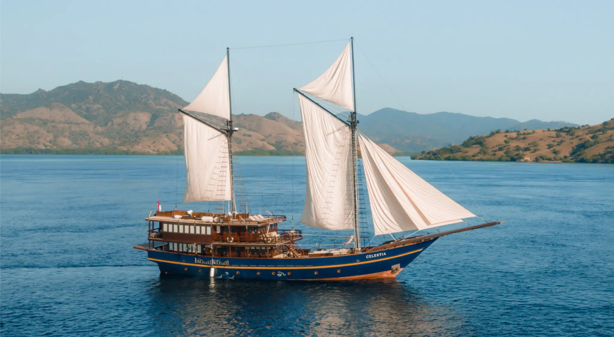 Celestia Luxury Yacht | Celestia sailing through Raja Ampat waters