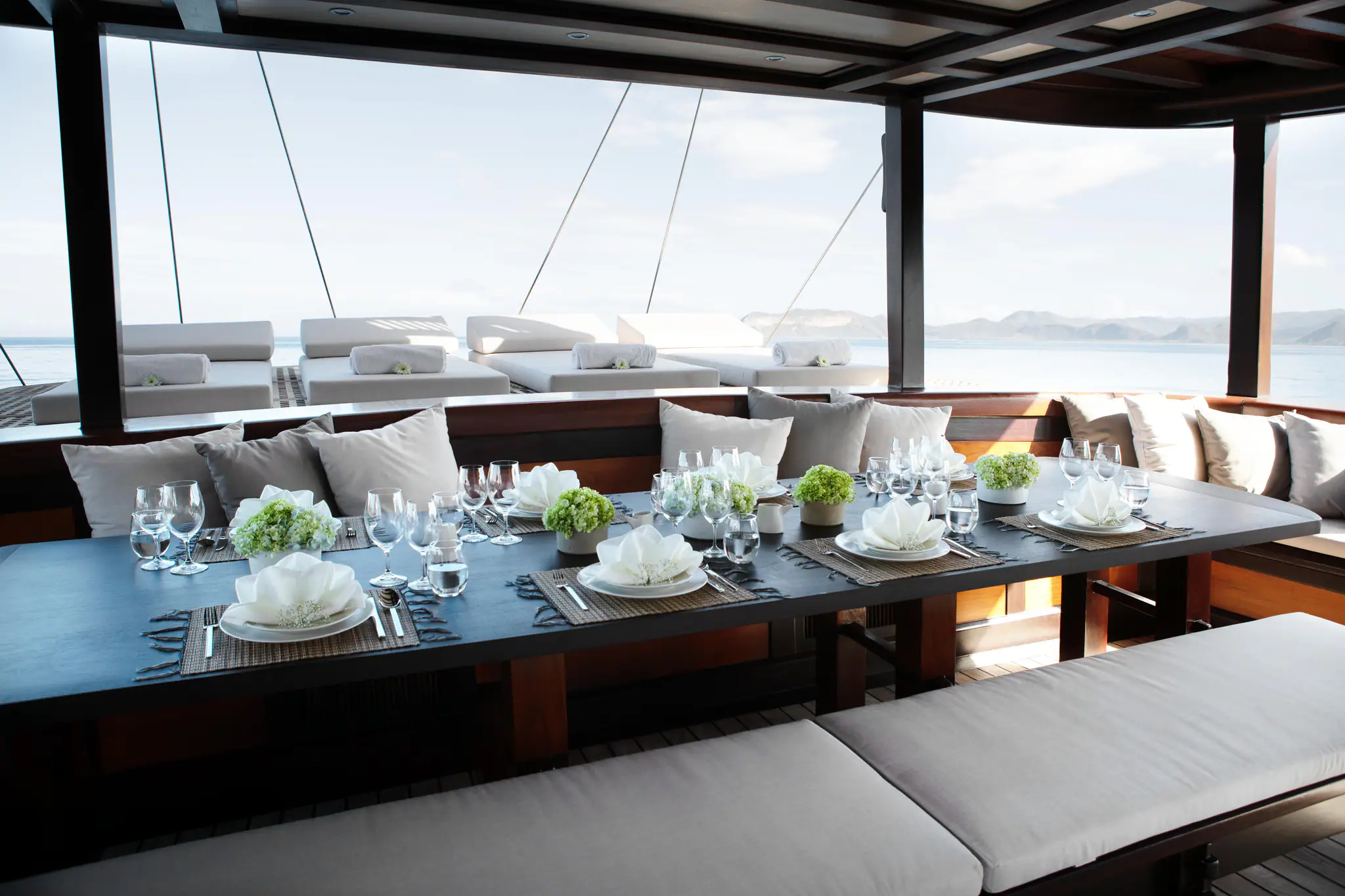 Dunia Baru Elegant Sailing Yacht | Elegant onboard dining setup