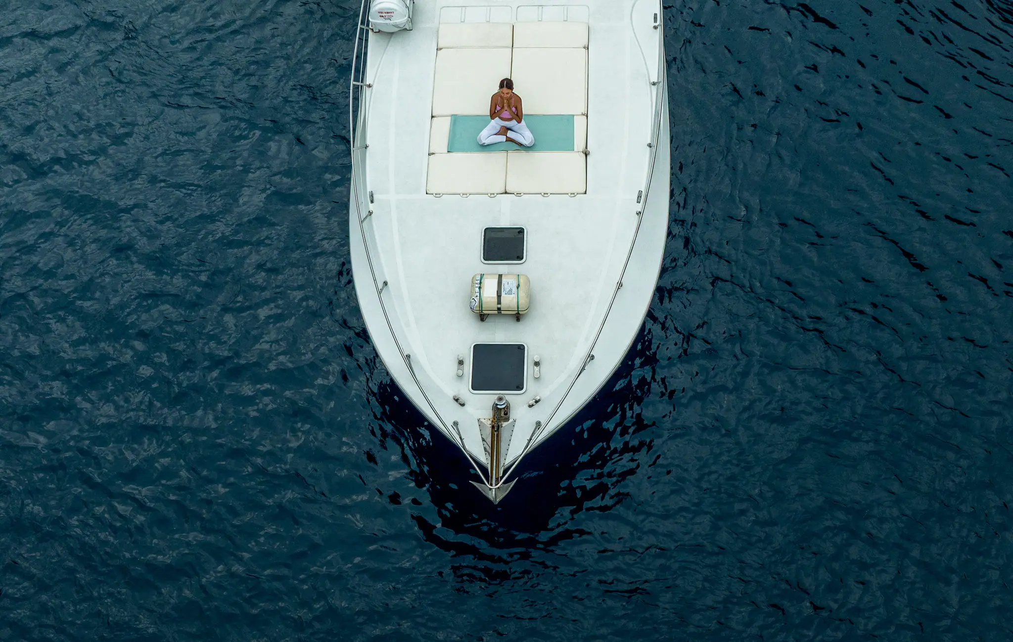 Forever Speedboat Vessel with guest practicing yoga