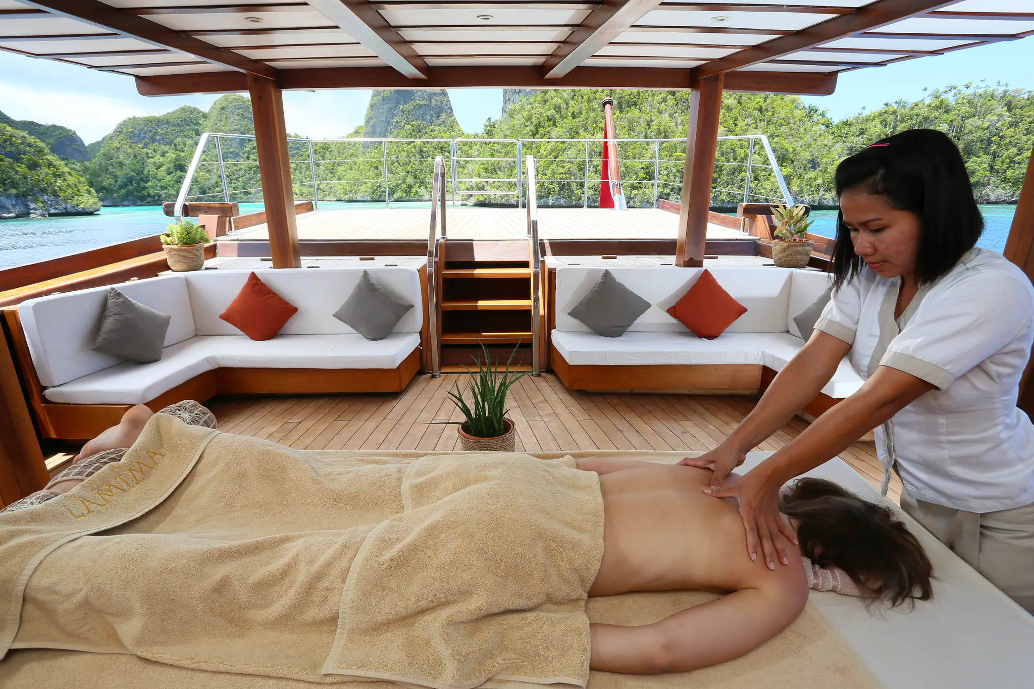 Lamima Phinisi Yacht | Guest enjoying massage onboard Lamima