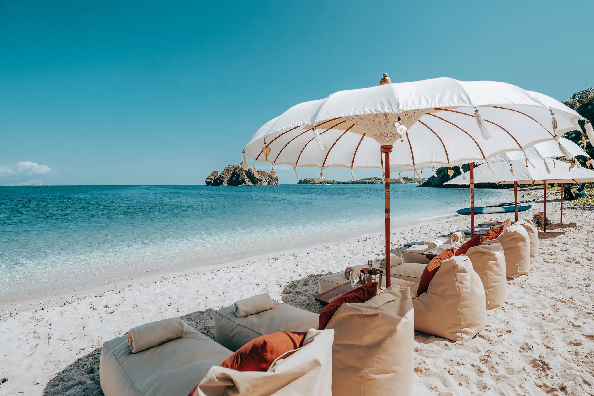 Lamima Phinisi Yacht | Beach lounge setup with parasols