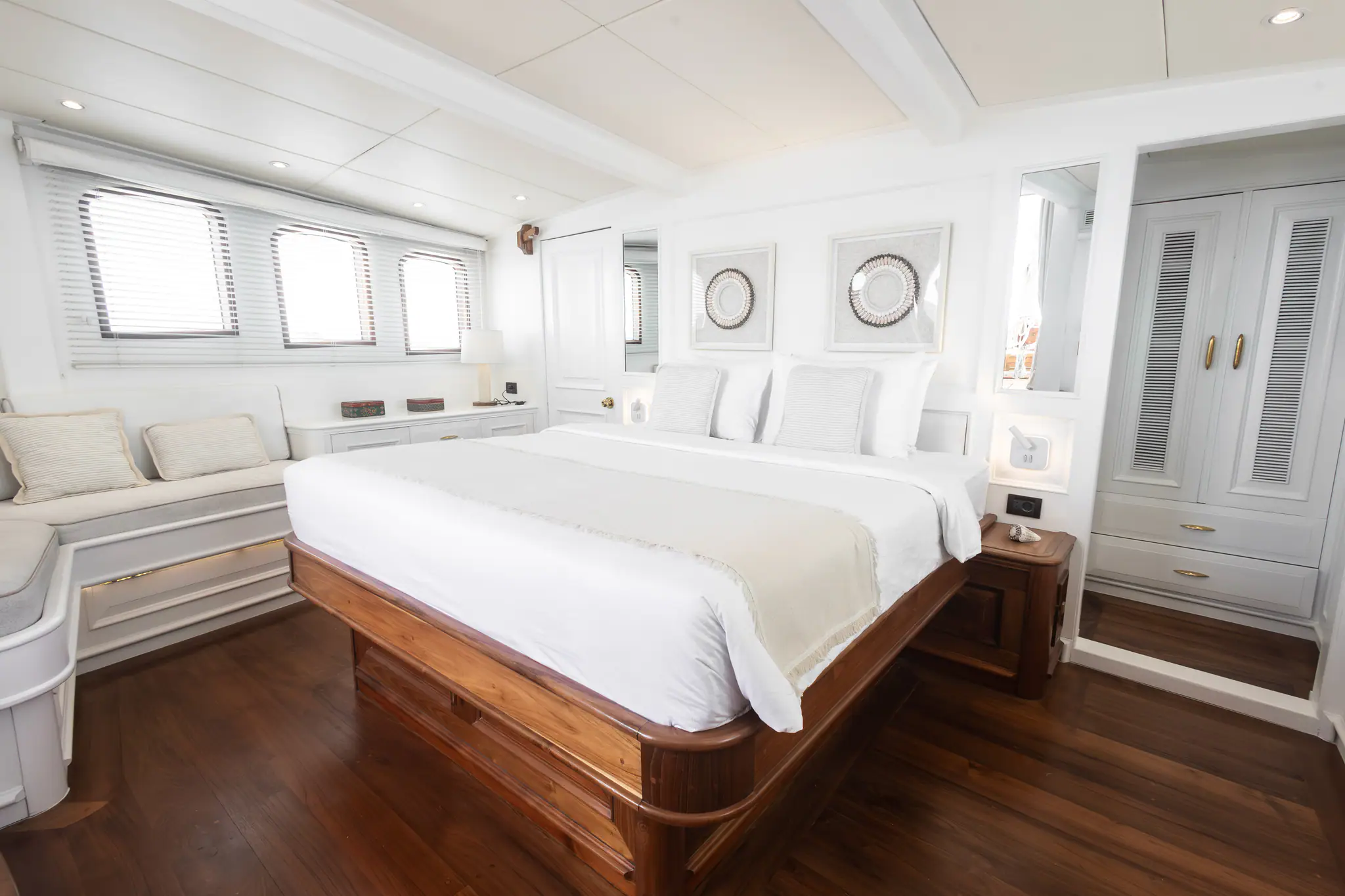 Mutiara Laut Luxury Yacht | Bright white master cabin aboard yacht