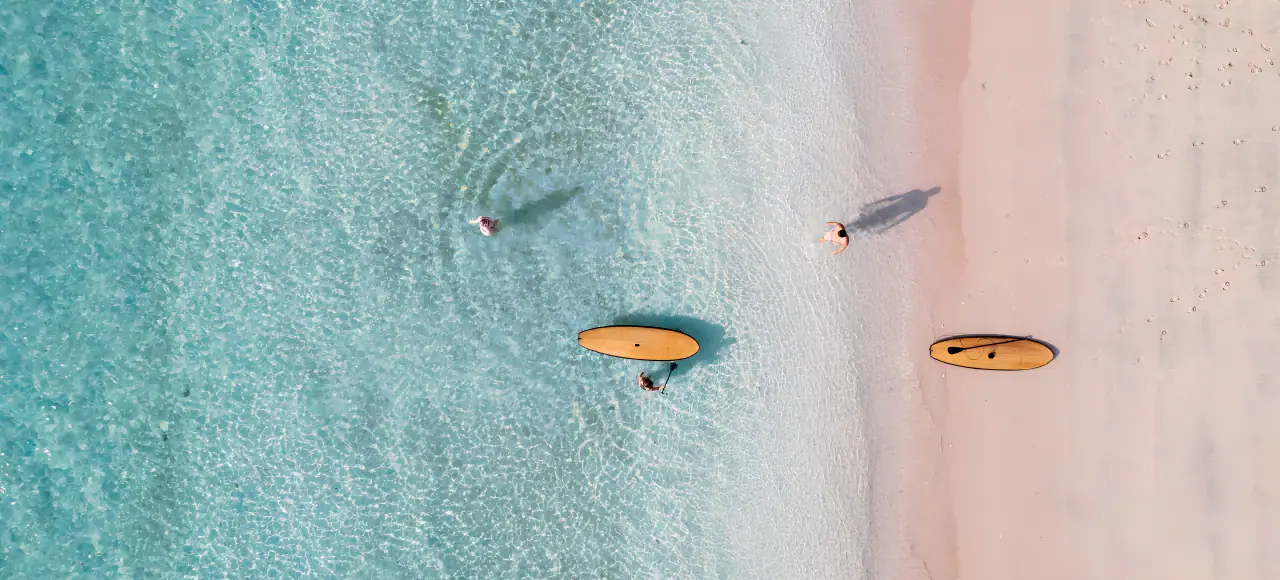 Prana Luxury Sailing Yacht | Aerial beach and paddleboards