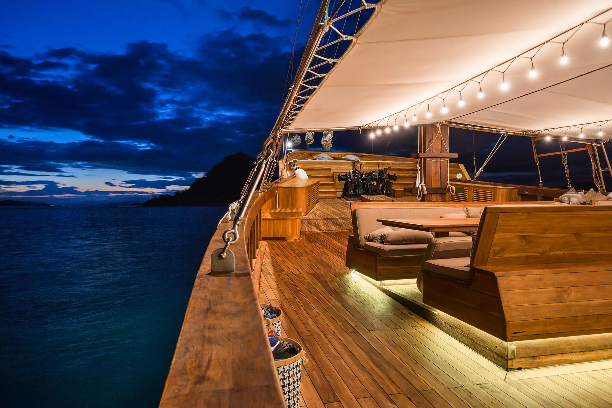 Prana Luxury Sailing Yacht | Open deck lounge at night