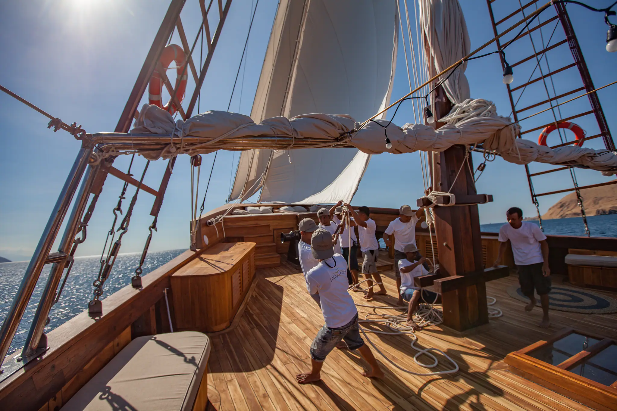 Prana Luxury Sailing Yacht | Crew raising traditional sails