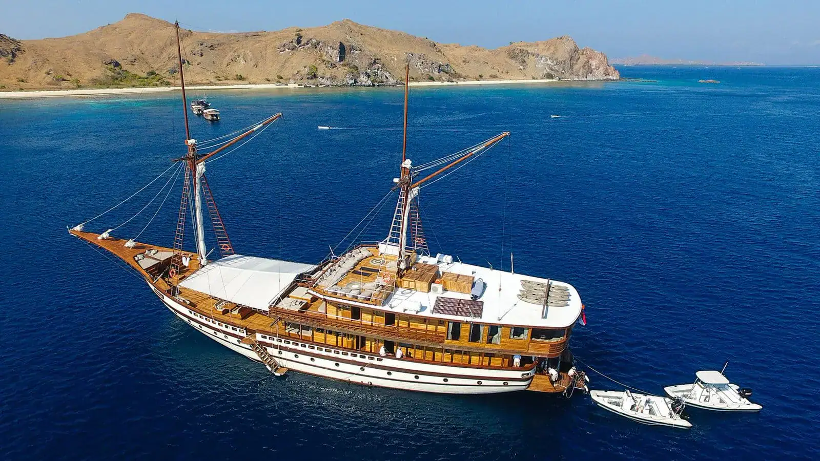 Prana Luxury Sailing Yacht | Cruising beside rugged island landscapes