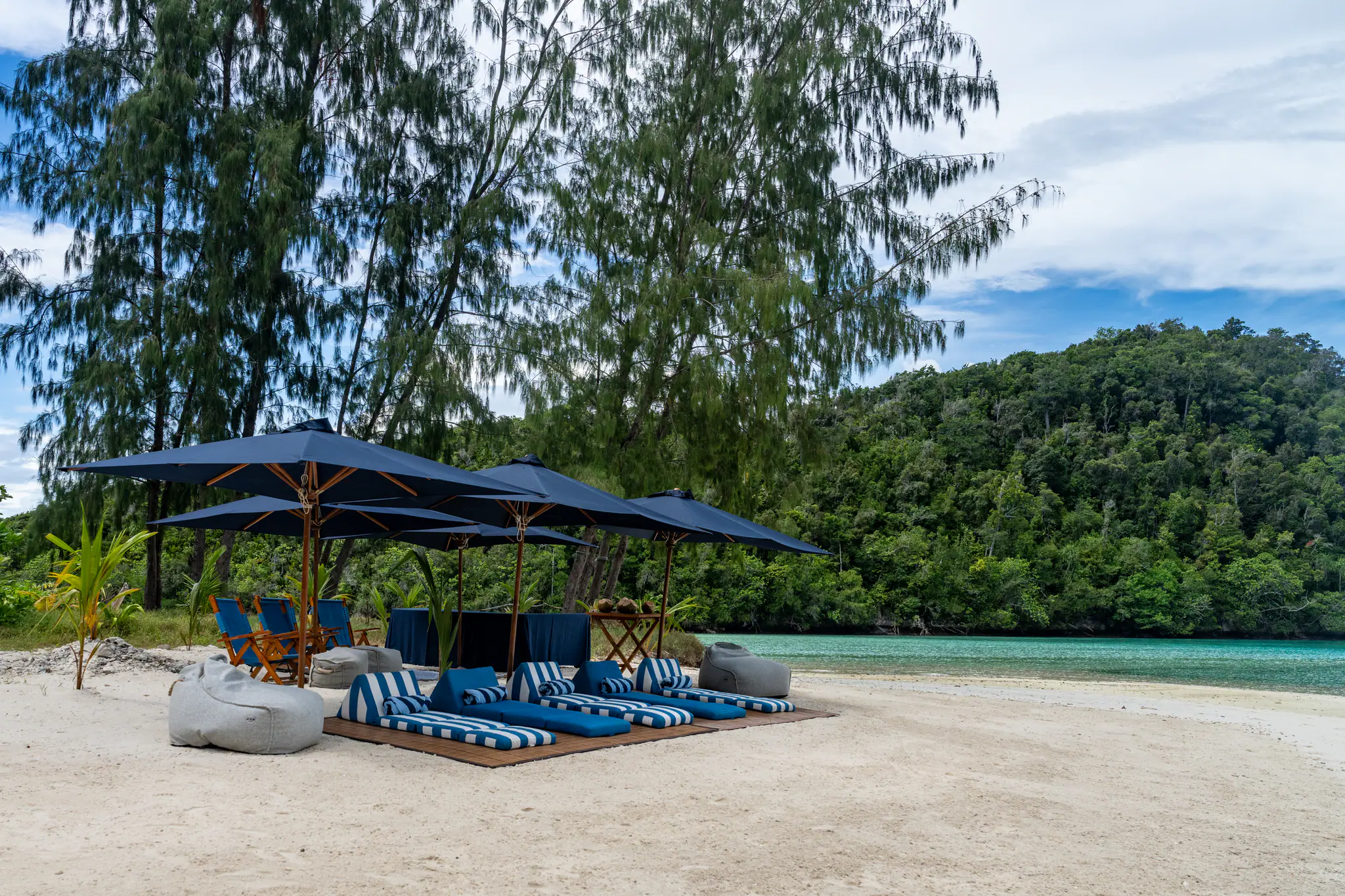 Rascal Adventure Yacht | Beach loungers on tropical shoreline