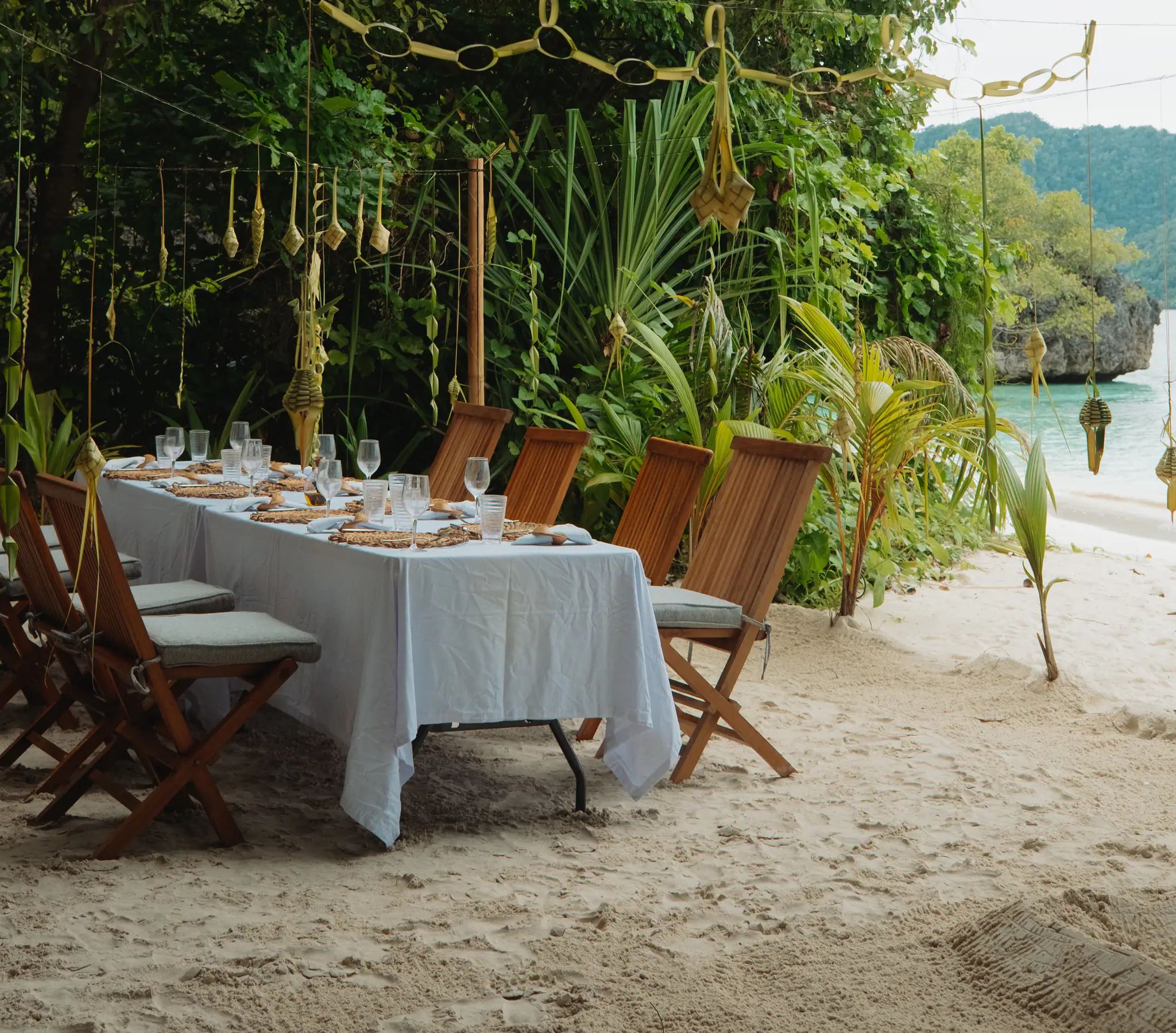 Rascal Adventure Yacht | Beachfront dinner beneath palm trees