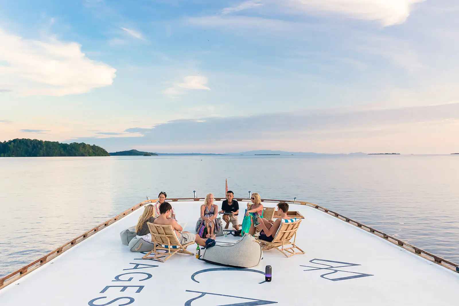 Rascal Adventure Yacht | Guests relaxing on rooftop deck