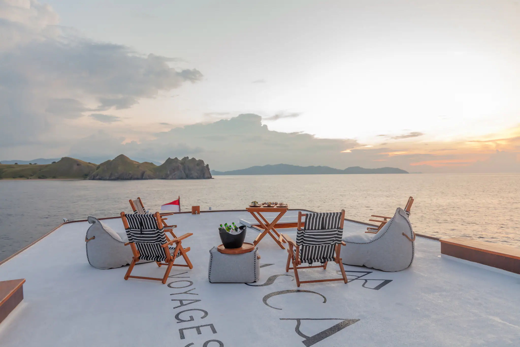 Rebel Adventure Yacht | Sunset rooftop lounge atmosphere