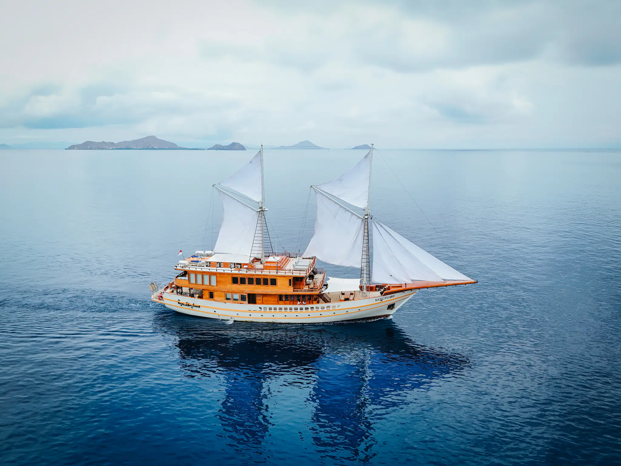 Sanctuary Grand Phinisi Yacht | Sailing across calm tropical waters